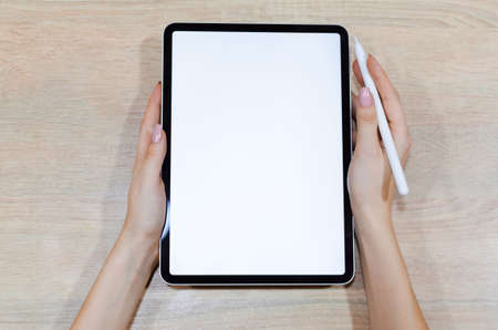 Girl using stylus on tablet to draw her ideas