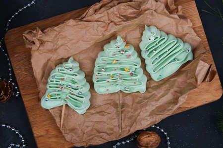Christmas composition. Festive cookies in Christmas tree shape on paper background.の写真素材