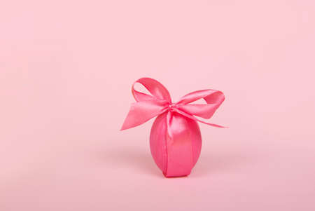 Nest with painted color easter eggs on yellow backgroundの写真素材