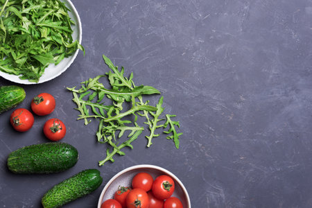 Fresh organic vegetables for healthy food cooking on dark background top view mock upの写真素材