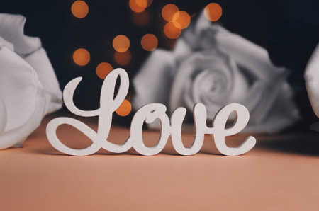 The word love in white letters on light background. Valentines Day, Mothers Day, World Womens Day holiday conceptの写真素材
