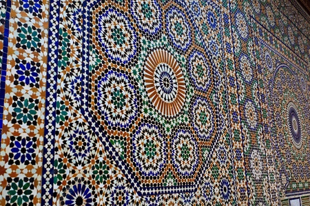 Meknes, Morocco: Ornate geometric mosaic tile work on mosque wall in Meknes, Morocco.のeditorial素材