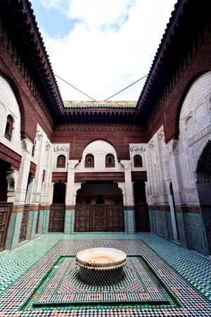 Meknes, Morocco: Interior courtyard with fountain of madrasah Muslim school in Meknes, Morocco.のeditorial素材