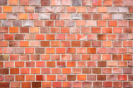red brick wall as a nicely textured and colorful backgroundの写真素材