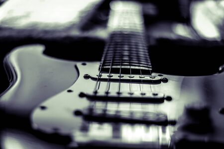Close up of electric guitar on with shallow depth of field