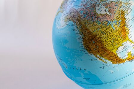 On a white background - a school globe with the image of the continents.