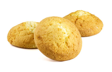 Sweets baking concept. Brown curd cookies close-up on a white background.