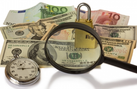 watch, magnifying glass, lock and money on a white backgroundの写真素材