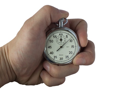 Vintage sport timer stop watch in man's hand. Isolated on whiteの写真素材