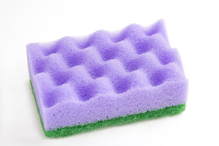 Purple sponge for cleaning on a white .の写真素材