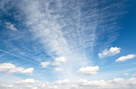 Cirrus and cumulus clouds in the blue sky morning.