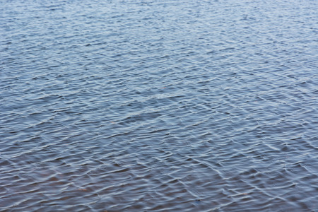 Ripples in the river water. Soft focus.の写真素材