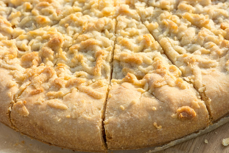 Fragment of cut homemade pie. Close-up.