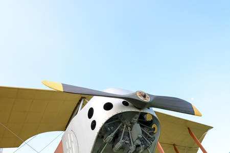 Fragment the old airplane on a background of blue sky. Close-up.