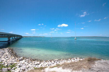 Shoreline of the Florida Keys with pretty blue sky and clouds.の写真素材