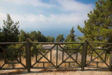 beautiful fence on the edge of the mountain next to the precipiceの写真素材