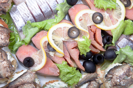 Plate with different fish delicacies isolated on white background. Shallow depth of fieldの写真素材