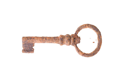 Old rusty key isolated on white background.の写真素材