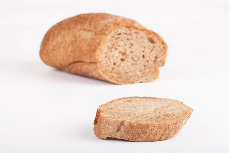a piece of black baguette isolated on white backgroundの写真素材