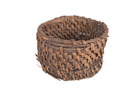 old round wicker willow basket isolated on white backgroundの写真素材