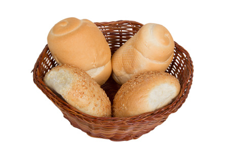 bread in a wicker basket isolated on white backgroundの写真素材