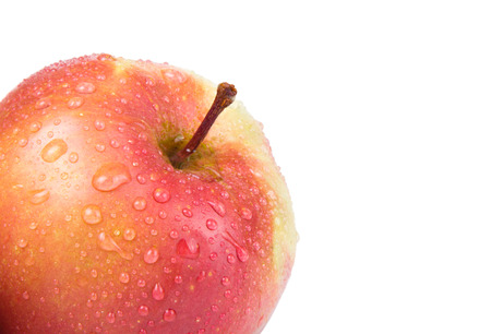 Apple with drops in the corner isolated on a white background. Shallow depth of fieldの写真素材