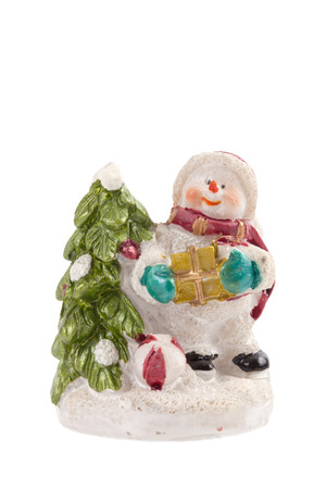 Snowman with Christmas tree and gifts isolated on white backgroundの写真素材