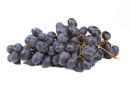 Bunch of black grapes isolated on white backgroundの写真素材