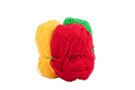Green yellow red skeins of wool isolated on a white backgroundの写真素材