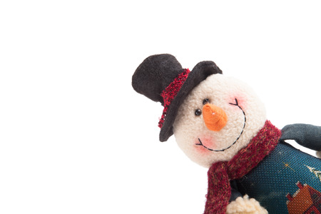 snowman looking out of the corner isolated on a white backgroundの写真素材