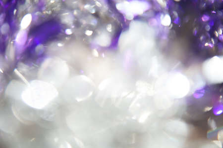 Abstract Christmas twinkled bright background with bokeh defocused silver and blue lightsの写真素材