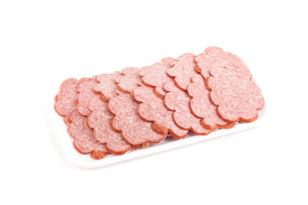 Sliced sausage in the package isolated on a white backgroundの写真素材