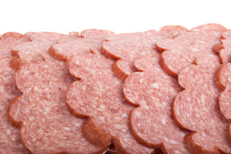 sliced ââsausage on a white backgroundの写真素材