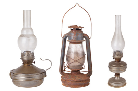 Three antique kerosene lamps isolated on white backgroundの写真素材