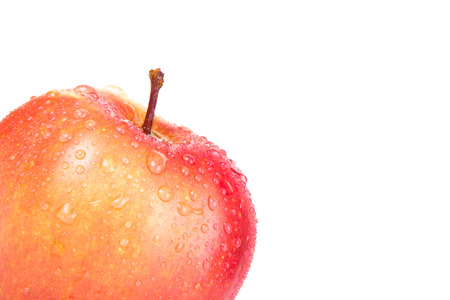 Apple with drops in the corner isolated on a white background. Shallow depth of fieldの写真素材