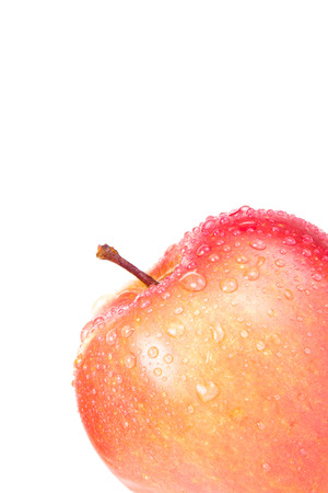 Apple with drops in the corner isolated on a white background. Shallow depth of fieldの写真素材