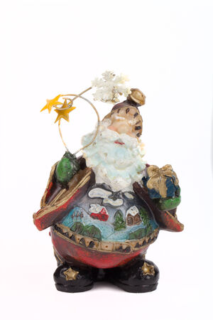 ceramic figurine of Santa Claus looking at the sky isolated on white backgroundの写真素材