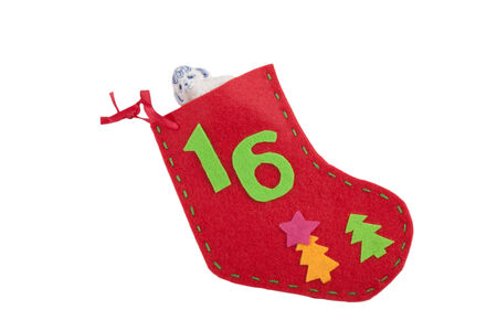 Christmas sock with gift lamb isolated on white backgroundの写真素材