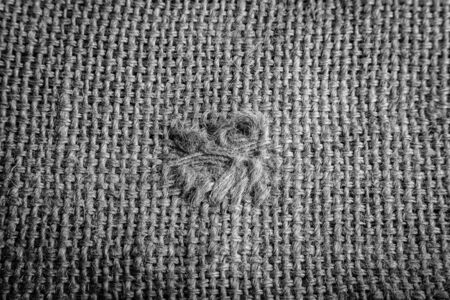 sackcloth with a patched hole. black and whiteの写真素材