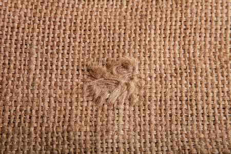 sackcloth with a patched holeの写真素材