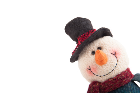 snowman looking out of the corner isolated on a white backgroundの写真素材