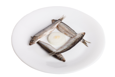 Sprats on plate isolated on white backgroundの写真素材