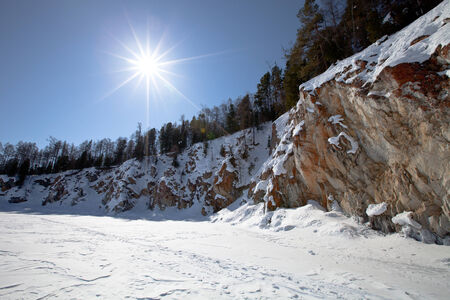 Lake Baikal. Winter. Coast with rocks and pine treesの写真素材