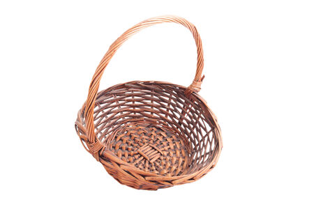 Old dusty wicker basket isolated on white backgroundの写真素材