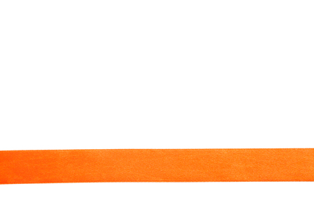 Orange satin ribbon isolated on white backgroundの写真素材