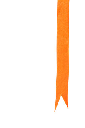 Orange satin ribbon isolated on white backgroundの写真素材