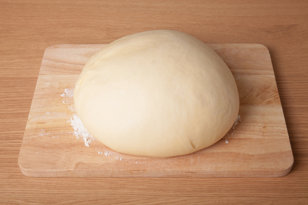 dough on a board with flour.の写真素材