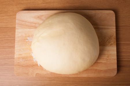 dough on a board with flour.の写真素材