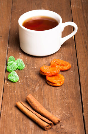 Cup of tea on old wooden tableの写真素材