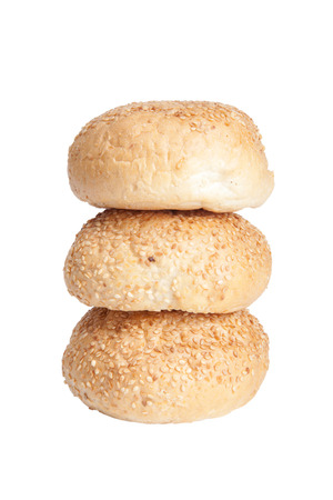 buns for breakfast sprinkled with sesame seeds isolated on white backgroundの写真素材